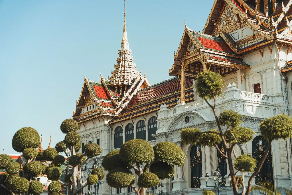 Beautiful royal palace with ornate architecture and trees. Image depicting royal.